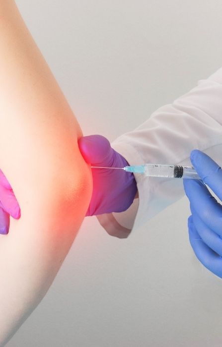 Doctor Administering Joint Injection In Ankeny
